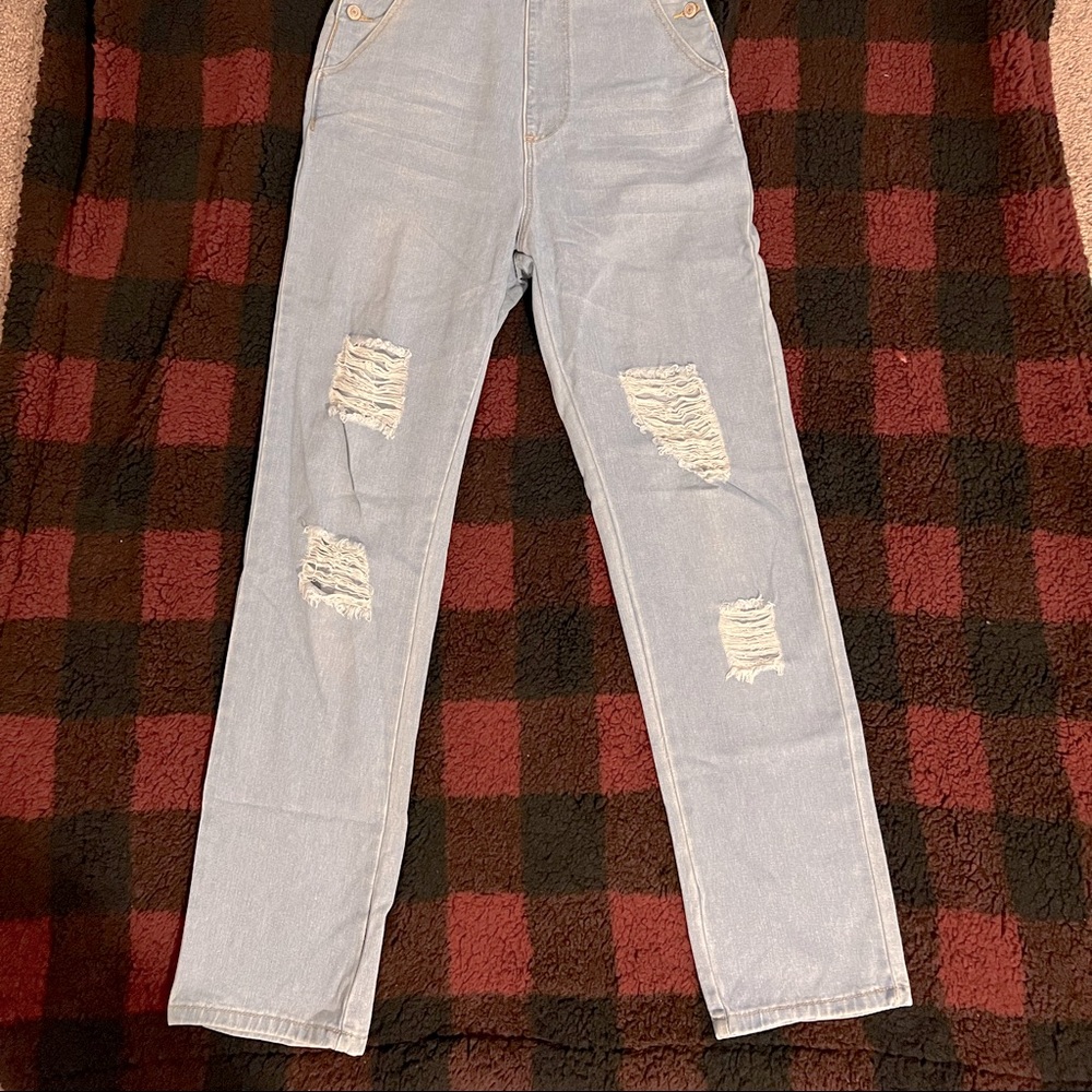 Bleached, ripped pocket front denim overall